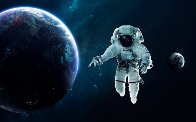 Astronaut and Earth planet. Science fiction wallpaper. Elements of this image furnished by NASA