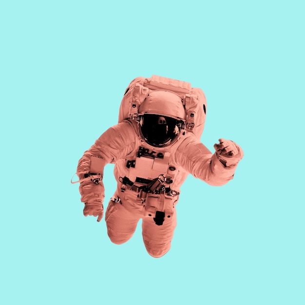 Astronaut in pastel coral color on a blue background