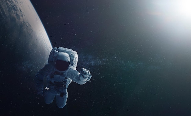 Astronaut and space background Elements of this image furnished by NASA