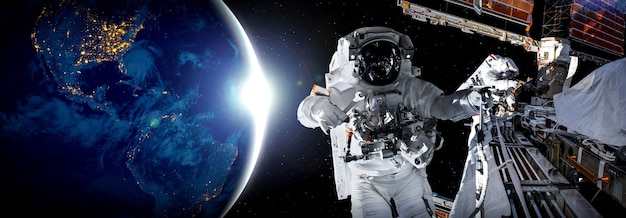 Astronaut spaceman do spacewalk while working for space station