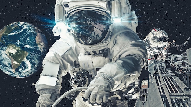 Astronaut spaceman do spacewalk while working for spaceflight mission