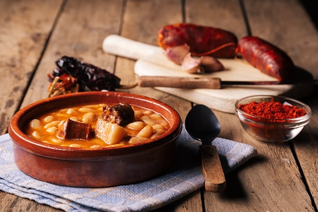 Asturian bean stew on wooden table