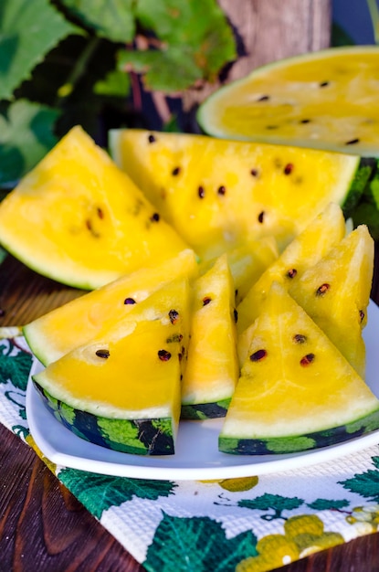 Atermelon with yellow pulp on the table