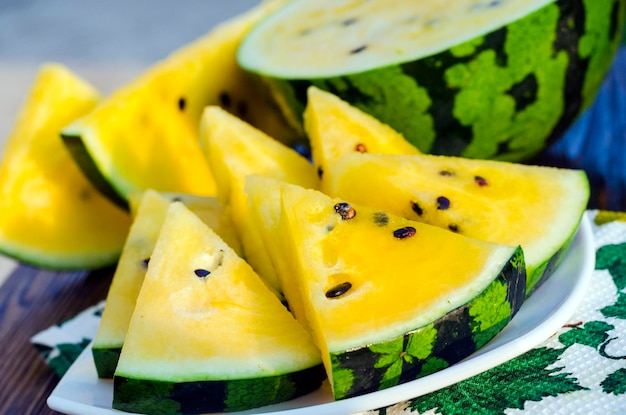 Atermelon with yellow pulp on the table