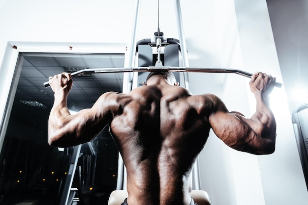 Athlete man doing back exercises