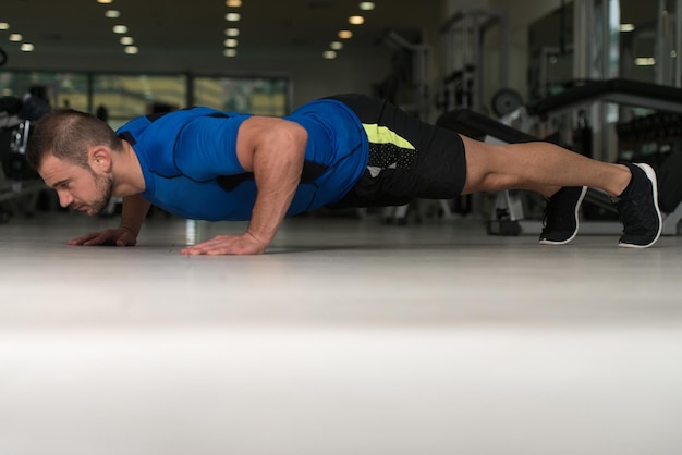 Athlete Man Doing Push Ups On Floor