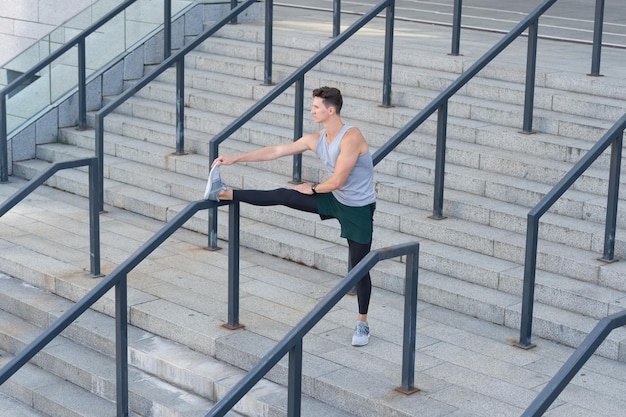 Athlete man stretching outdoor athlete man stretching outside athlete man stretching