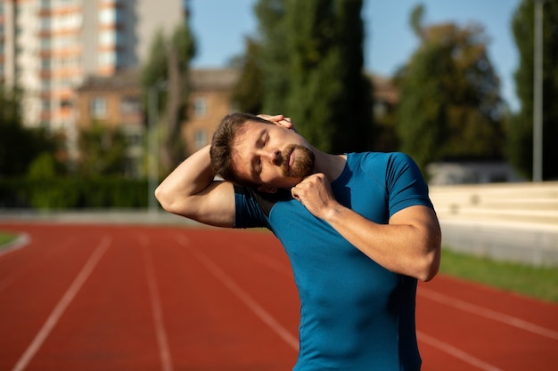 athlete man warming at the stadium