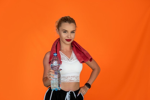 An athlete with a thin waist and beautiful eyes poses for the camera