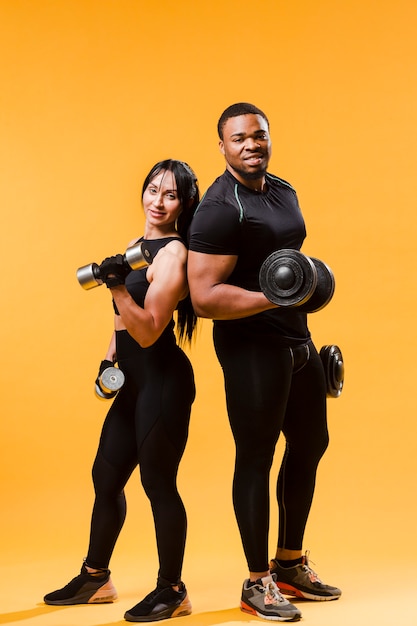 Athletes posing with weights