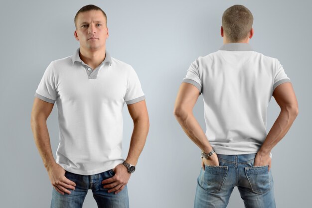 Athletic man in the blank polo shirt and blue jeans  isolated on the gray wall, front and back view.