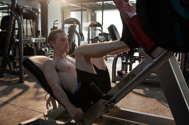 Athletic Man Doing Legs Press