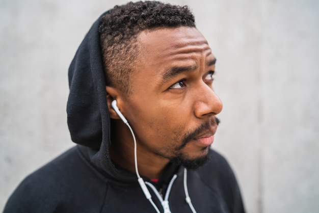 Athletic man listening to music