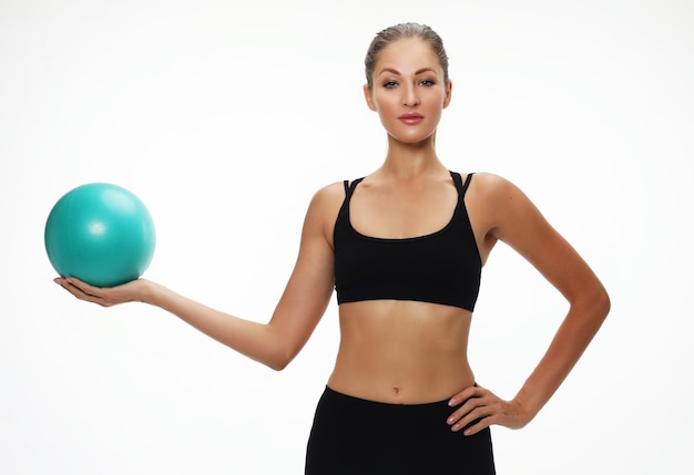 Athletic woman doing exercise with medicine ball