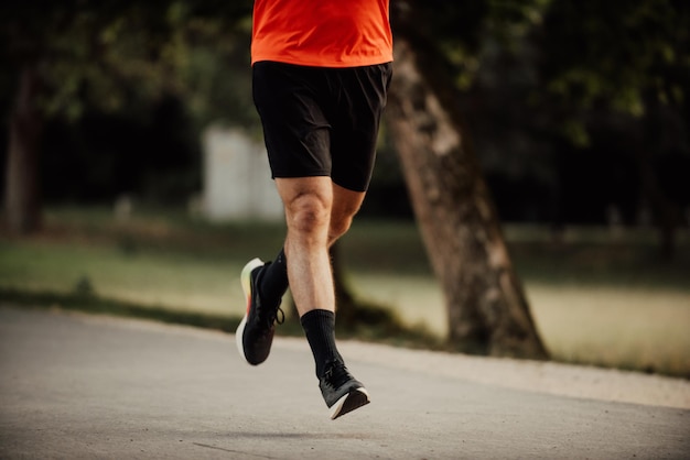 Athletic young man running in nature Healthy lifestyle