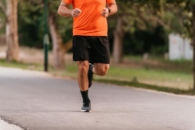 Athletic young man running in nature Healthy lifestyle