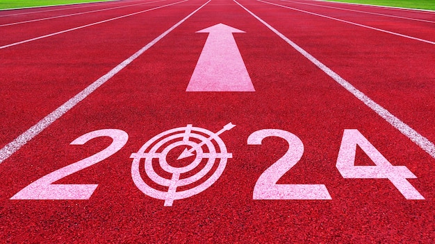 Athletics track road with New year 2024 concept Direction to new year concept and sustainable development idea for goal and success concept for vision 20232025