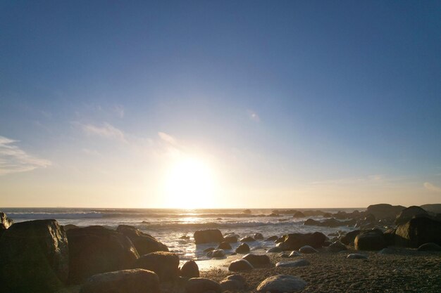 Atlantic ocean coast with the granite rocks on the sunset