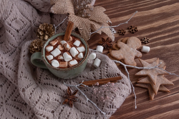 Atmospheric christmas composition a cup of cocoa with marshmallows gingerbread cookies sweets cinnamon