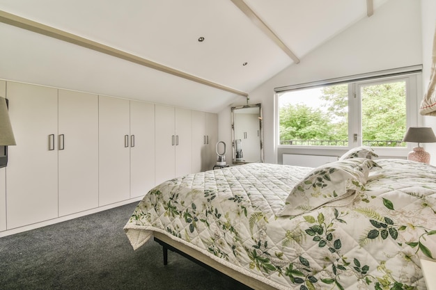 Attic bedroom interior with panoramic window