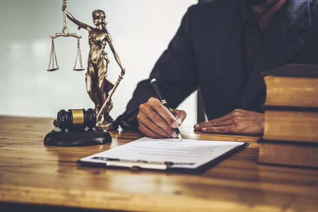 Attorneys sign legal contract documents. while sitting in a private office.