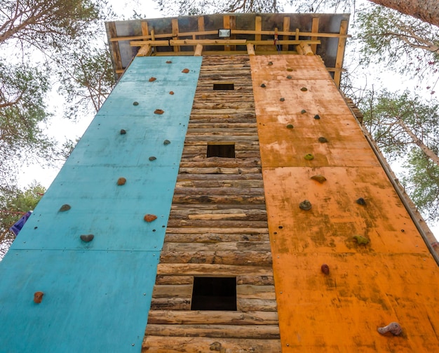 Attraction Climbing wall in the forest on a winter day.
