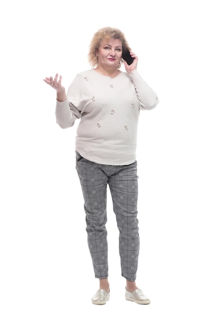 Attractive adult woman with a smartphone isolated on a white