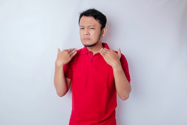 Attractive Asian man with hand gesture pose rejection or prohibition with copy space