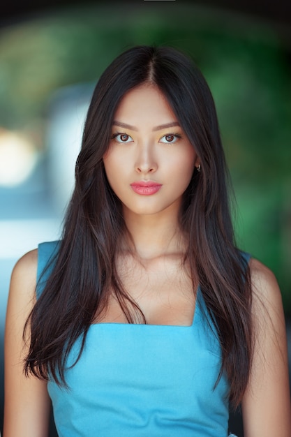 Attractive asian woman portrait outdoors in the city