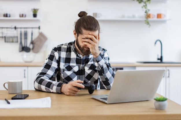 Attractive bearded male upset to losing at video games