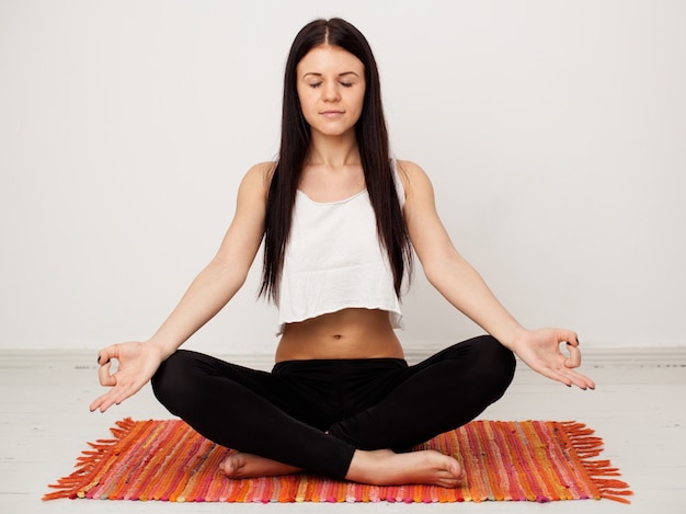 Attractive brunette in a lotus position