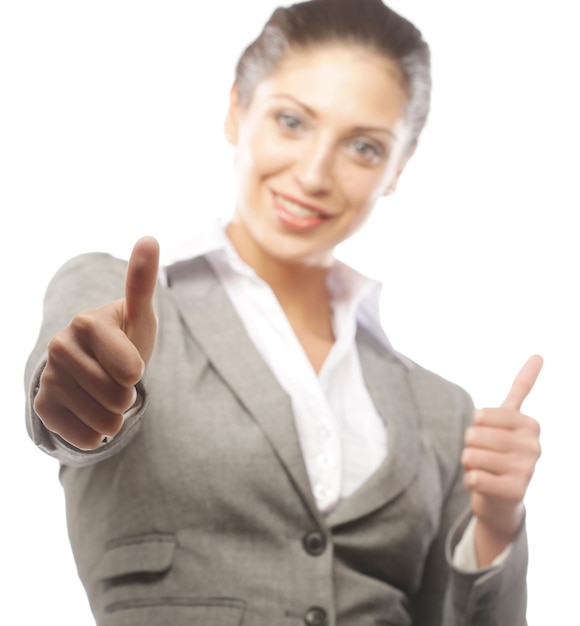 Attractive business woman giving thumbs up