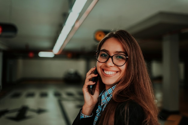 An attractive business woman in glasses using a smartphone Selective Focus Business Portrait