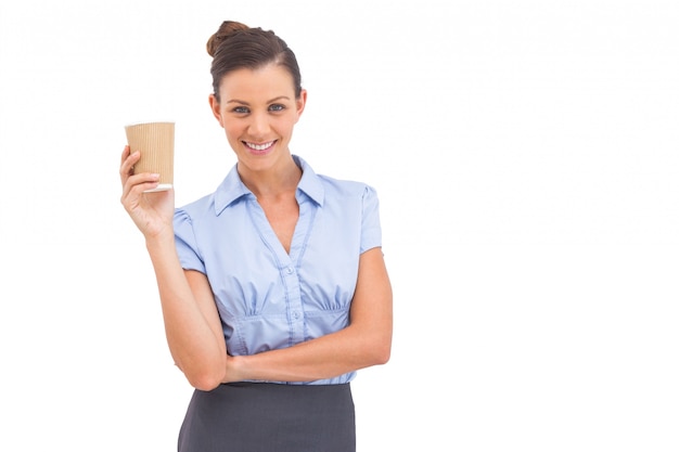 Attractive businesswoman holding coffee cup