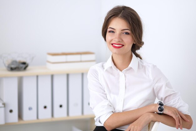 Attractive businesswoman sitting in the office