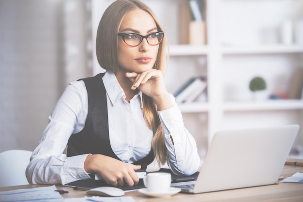 Attractive businesswoman at workplace