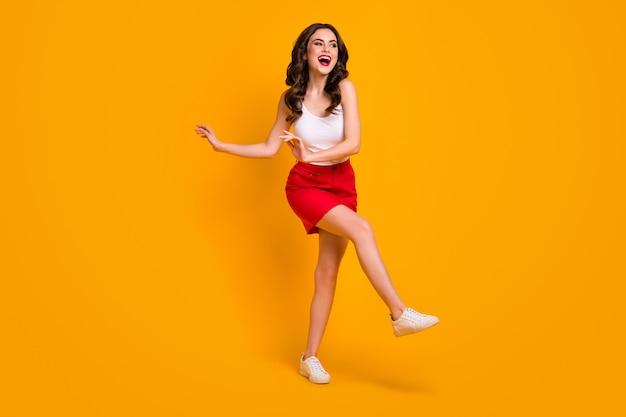 attractive cheerful lady raise leg dance