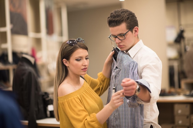 Attractive Couple Shopping In A Man's Clothing Store