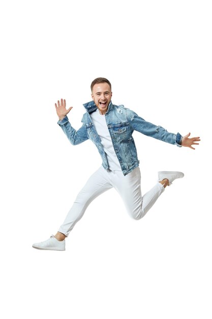 Attractive crazy man in denim tshirt jeans jump