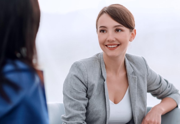 Attractive female friends chatting during an office break