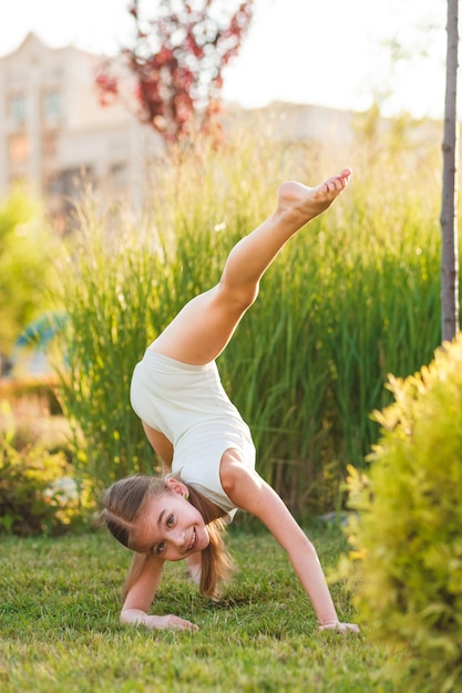 attractive girl doing sports in summer park