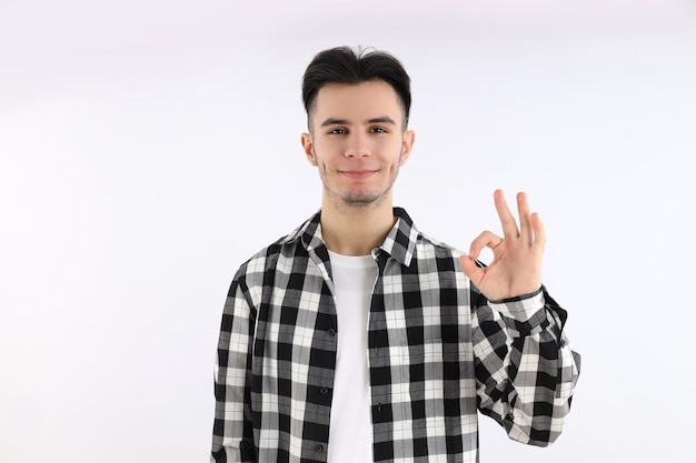 Attractive guy in shirt on white background