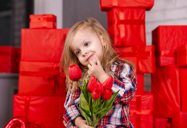 Attractive kid open gift birthday charming girl is surprised