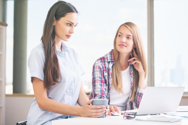 Attractive ladies working on project