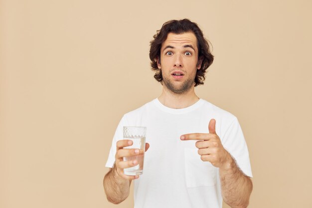 Attractive man glass of water in his hands emotions posing Lifestyle unaltered