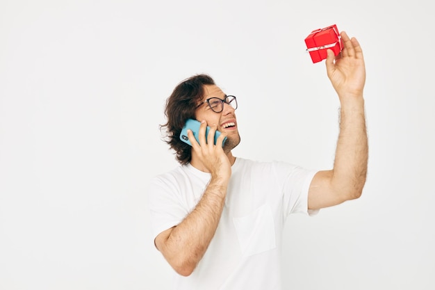 Attractive man Red gift box telephone communication isolated background