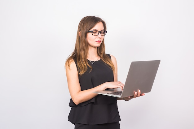 Attractive mature businesswoman working on laptop.