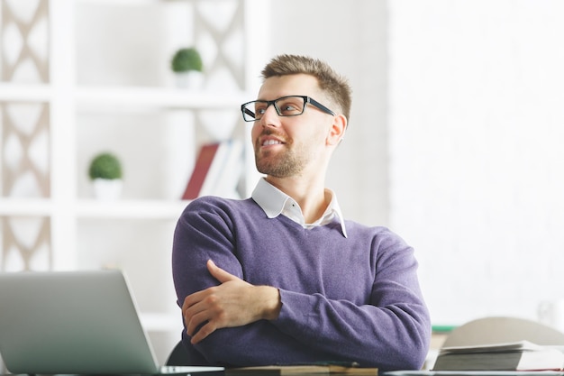 Attractive smiling man working on project