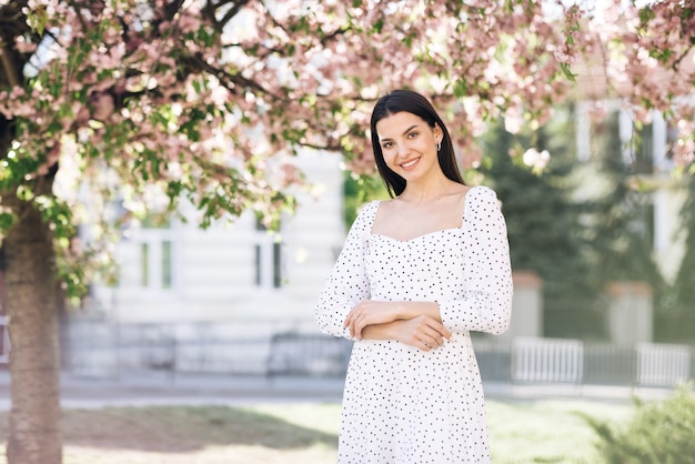 attractive sunshine young smiling woman with long hair look at camera smile happy summer face