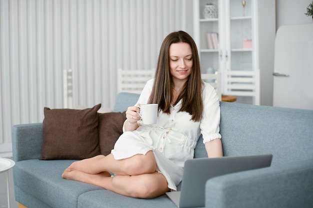 Attractive woman chatting with friends via video link